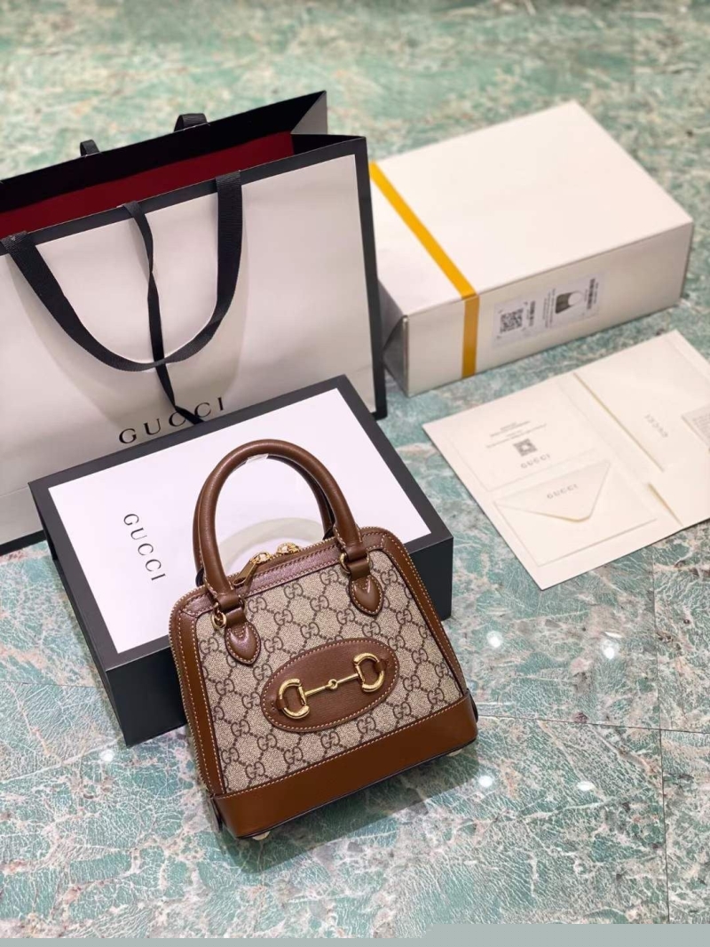 G*u*i top handle bags